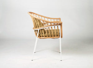 Unique designer dining chair Made of natural rattan bound with paper loom and metal frame. Green cushion. 